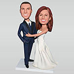 Custom groom in blue suit and bride in white wedding dress bobblehead 
$162.59...